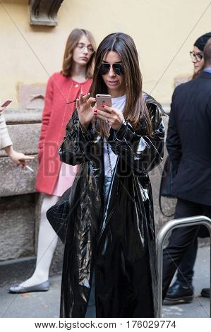 MILAN ITALY - FEBRUARY 25: Fashionable woman poses outside Blumarine fashion show during Milan Women's Fashion Week on FEBRUARY 25 2017 in Milan.