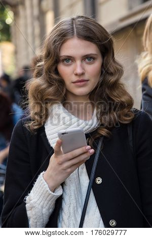 MILAN ITALY - FEBRUARY 25: Beautiful model poses outside Blumarine fashion show during Milan Women's Fashion Week on FEBRUARY 25 2017 in Milan.