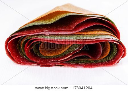 Tklapi - dried mashed fruit pulp / Colorful fruit leather from apricot kiwi dogwood. Georgian and Armenian cuisine.