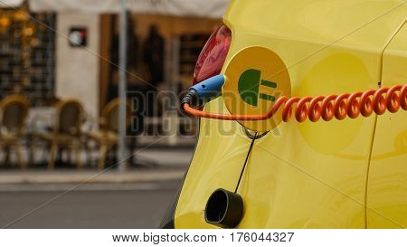 Power supply for electric car charging. City electric car charging station. Close-up.