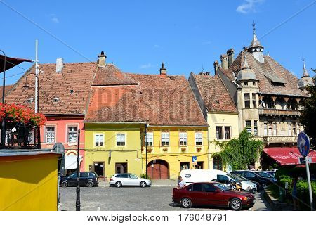 Market Square and typical urban landscape in the downtown of the medieval city Sighisoara, Transylvania