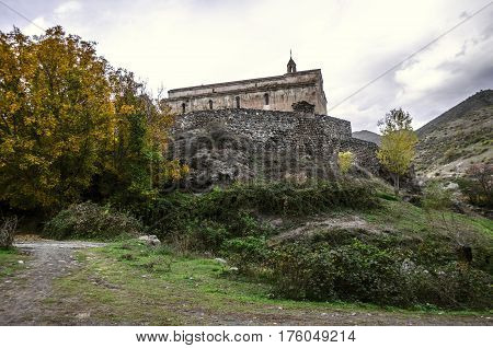 View of the medieval monastery Tsitsernavank in the autumn overcast day
