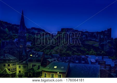 View of the Church and the Castle in the Belgian City of La Roche. View of the town centre below its medieval Castle in of La Roche at night.