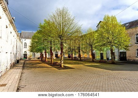 Patio of the Belgian house with park. The old pavement in St Hubert Belgium
