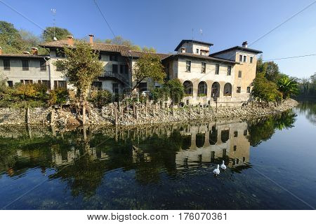 Country house along the Naviglio Grande of Turbigo (Milan Lombardy Italy) at fall with geese