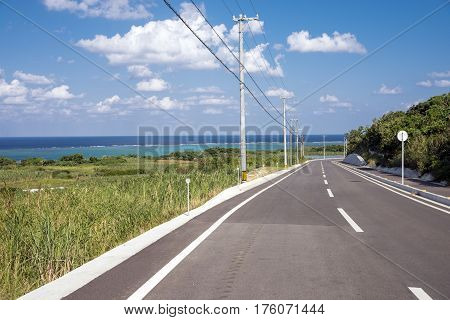 Country road near the sea under sky in Ishigaki island