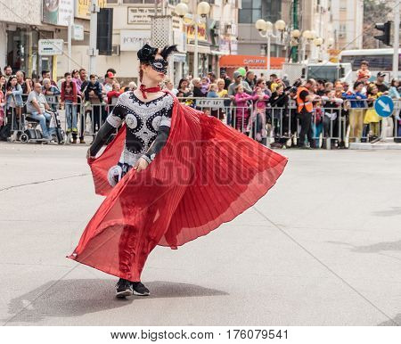 Participant At сarnival Is Walking Along The Street