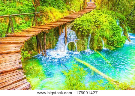 Deep forest cascades and tourist path in Plitvice lakes national park Croatia.
