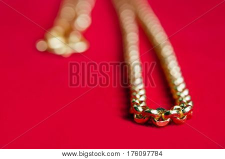 Gold Necklace 96.5 Percent Thai Gold Grade With Gold Heart Pendant Isolated On Red Flannel Cloth Bac