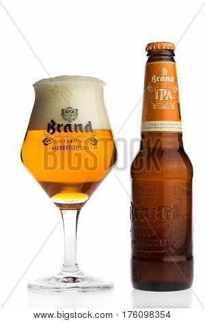 GRONINGEN, NETHERLANDS - MARCH 12, 2017: Bottle and glass of Dutch Brand IPA beer isolated on a white background