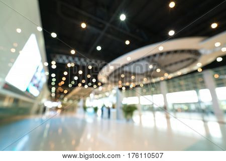 Public event exhibition hall blurred bokeh defocused background business trade show or modern interior architecture concept