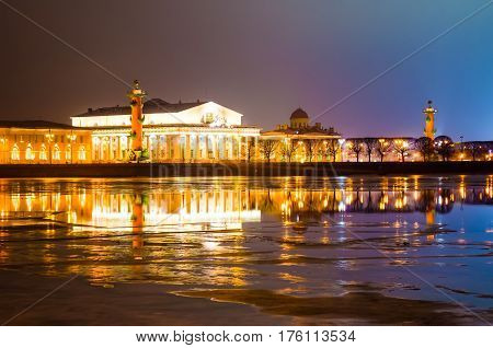 Arrow of Vasilyevsky Island at night in cloudy weather in St. Petersburg.