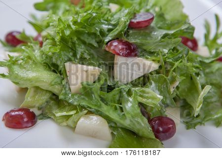 Fresh Salad Of Lettuce With Sweet Sauce With Pieces Of Fruit