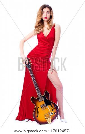 Podolsk, Russia - February 22, 2017: Young brunette Woman with a vintage electric guitar Gibson es-345 1969 model year
