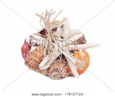 Decorative bag of various seashells from Red Sea isolated on white background