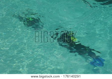 Cala Mariolu, Italy - 28 June 2013: Child discover scuba diving at Cala Mariolu beach on Sardinia, Italy