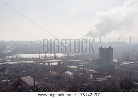 Morning, fog, smog, dirty polluted industrial area, smokesting pipes of plants and power stations