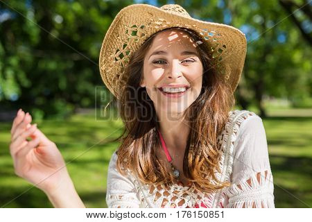 Happy Pretty Woman In Panama Hat Outside