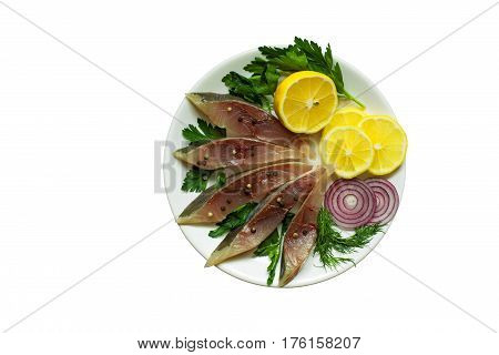 salted fish fillet with herbs lemon and spices in a plate isolated on white background. top view