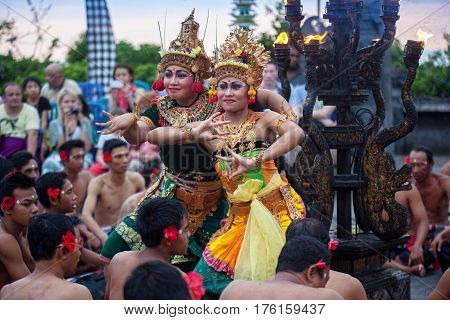 Bali Indonesia - March 03 2013: Kecak dance is a traditional ritual of Bali Indonesia.This dance is being shown at Uluwatu Temple.Blurred appearance of flowing dance.