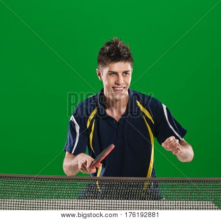 Happy smiling man playing ping pong green chromakey background