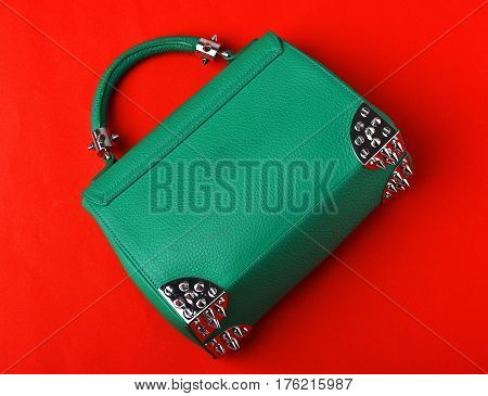 Small Womans Leather Green Bag With Metallic Spikes On Red
