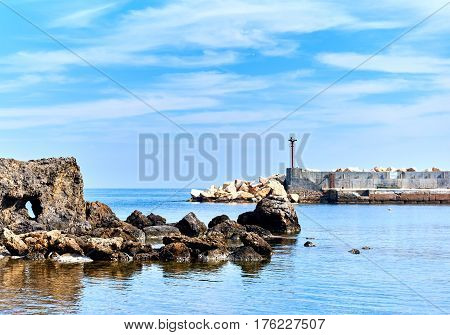 Rocky coast of Tabarca island. Turquoise clear water of Mediterranean Sea. Idyllic scene. Spain
