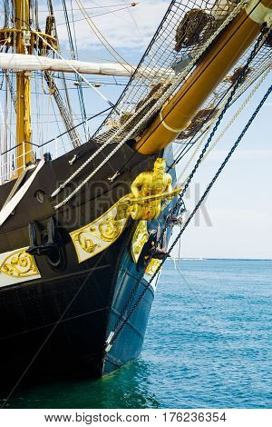 ODESSA UKRAINE - CIRCA August 2016: Education barquentine Italian Navy "Palinuro" moored at pier of the Odessa Sea Port. Bow of the ship close up shot. Bow sculpture figurehead sculpture