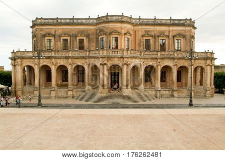 People Walking In Front Of The Ducezio Palace At Noto