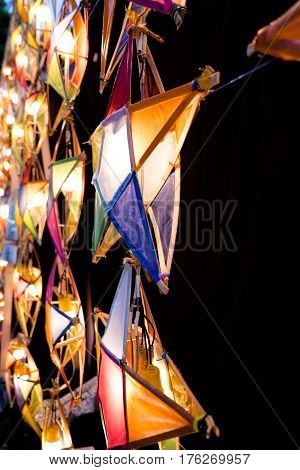 Multi colored star lamps and background .