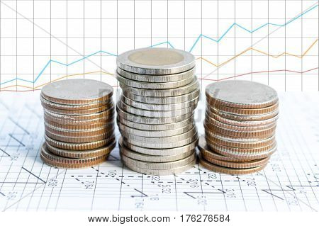 Double exposure coins with growing graph Saving money Economy Investment and Saving Concept.