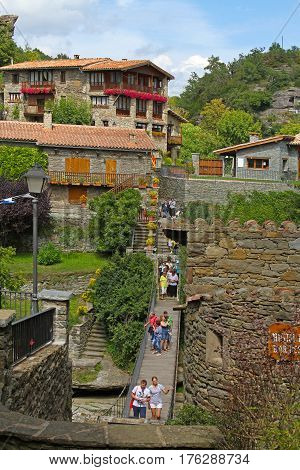 Rupit Spain - September 09 2014: Pendant bridge with people Rupit (Catalonia Spain)