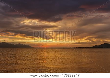 Beautiful cloudy sunset over the sea, Opuzen, Croatia