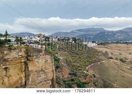 View of the buildings standing on the edge of a cliff in Rondo Spain