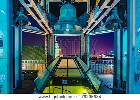 Bell of st. Ann's church in Old town Warsaw at night, Poland.