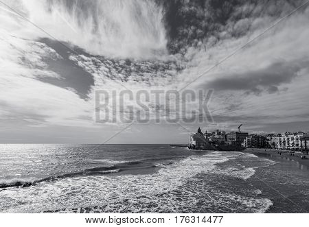 Wide angle view of the San Sebastian Beach, Sitges. Mediterranean sea in spanish coast. Black and white image