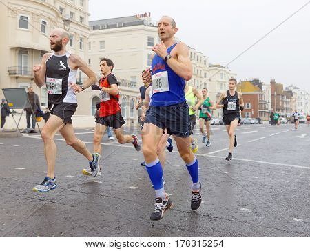BRIGHTON GREAT BRITAIN - FEB 26 2017: Group of men running in the Vitality Brighton half marathon competition. February 26 2017 in Brighton Great Britain
