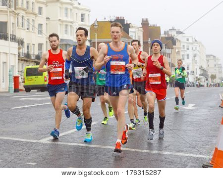 BRIGHTON GREAT BRITAIN - FEB 26 2017: Group of men running in the Vitality Brighton half marathon competition. February 26 2017 in Brighton Great Britain