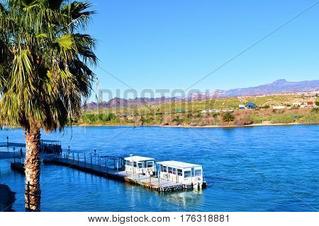 March 1, 2017 in Laughlin, NV:  Marina docks on the Colorado River taken in Laughlin, NV where people can take a Water Taxi to different Hotel Casino Docks alongside the River Boardwalk
