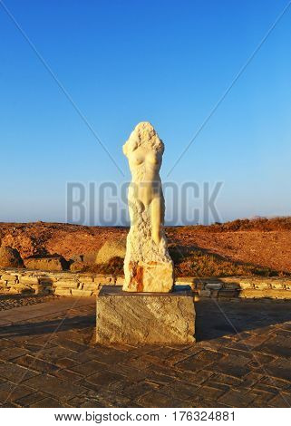 woman statue before the Portara Gate at Naxos island Greece