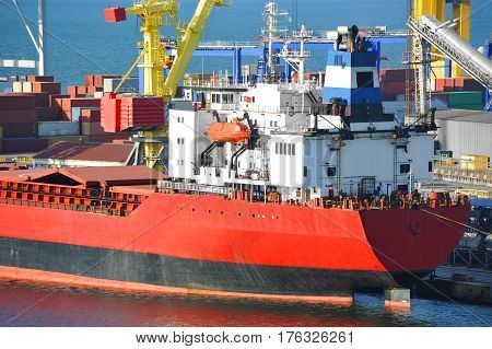 Bulk Cargo Ship Under Port Crane