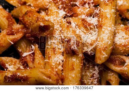 Italian food - Penne al'arrabbiata (Angry Pens), a classic italian pasta recipe with spicy tomato sauce, red hot peppers and parsley.