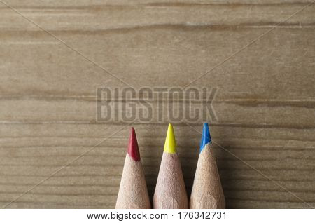 Row Of Three Pencils In Red, Yellow And Blue