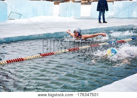 Sahyurta ,irkutsk Region, Russia - March 11.2017: Cup Of Baikal. Winter Swimming. Butterfly. Woman
