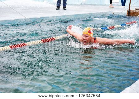 Sahyurta ,irkutsk Region, Russia - March 11.2017: Cup Of Baikal. Winter Swimming. Butterfly. Woman