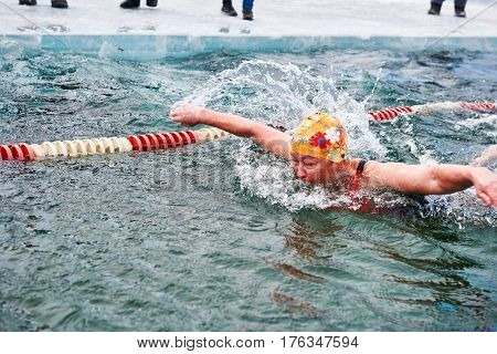 Sahyurta ,irkutsk Region, Russia - March 11.2017: Cup Of Baikal. Winter Swimming. Butterfly. Woman