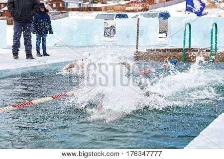 Sahyurta ,irkutsk Region, Russia - March 11.2017: Cup Of Baikal. Winter Swimming. Butterfly