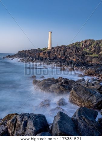 Ninini Point Lighthouse on Nawiliwili Bay in  Kaua'i' Hawai'i overlooking the ocean.
