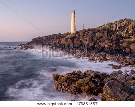 Ninini Point Lighthouse on Nawiliwili Bay in  Kaua'i' Hawai'i overlooking the ocean.