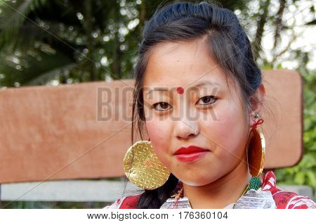 HYDERABAD,INDIA-MARCH 3:Closeup portrait of North eastern tribal woman dancer,with details of ornaments and dress in Shilparamam on March 3,2017 in Hyderabad,India